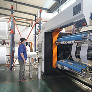 Precision Slitting for Custom Roll Widths Precision CNC slitting machine cutting paper rolls to custom widths