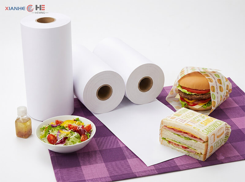 View Greaseproof Paper Product Range PFAS-free greaseproof paper sheets used for fast food wrapping
