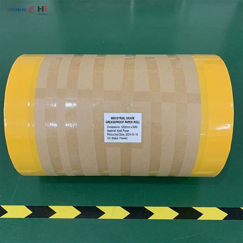 Industrial sized grease paper roll securely wrapped in yellow protective moisture-proof film