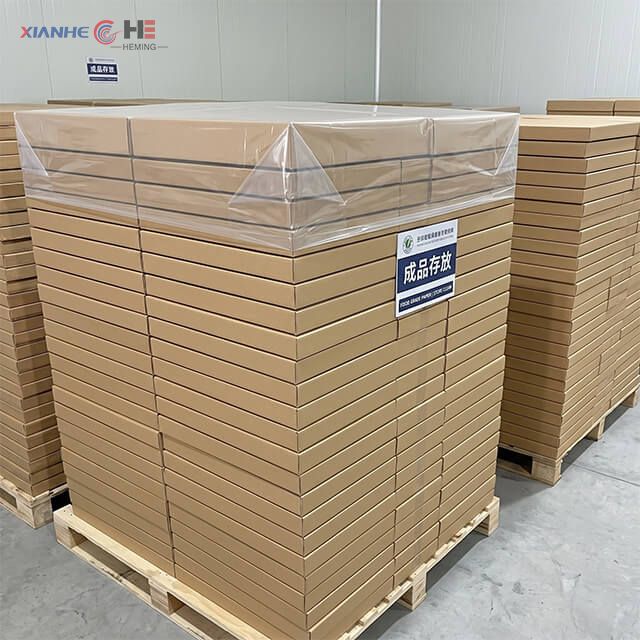 Bulk cartons of hamburger wrapping paper stacked on a pallet ready for wholesale distribution