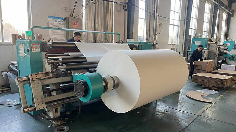 Large-scale CNC paper slitting machine and heavy jumbo roll storage at Quzhou converting hub near Ningbo port