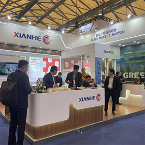 International buyers reviewing specialty paper product samples at Heming Paper display counter