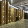 Vertical storage of heavy-duty silicone-coated baking paper jumbo rolls in factory warehouse