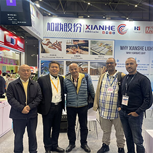 Heming Paper sales representatives and international specialty paper distributors at global trade show