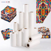 Various sizes of industrial sublimation paper rolls with vibrant printed textile fabric samples for bulk supply