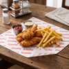 Oil resistant greaseproof paper sheets used as wire basket liners for fried chicken and french fries