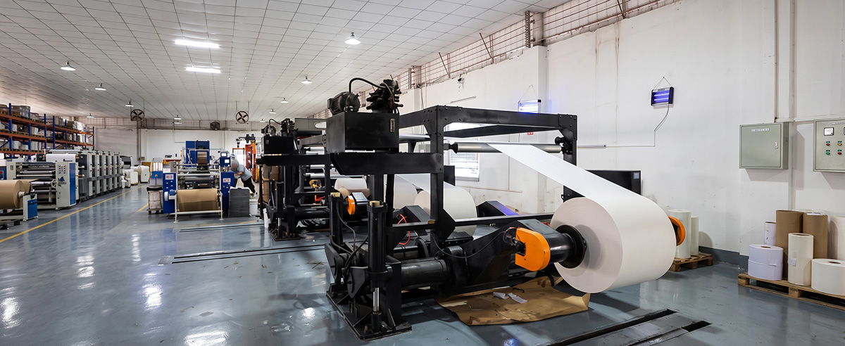 Automated factory production line manufacturing white butcher paper rolls