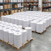 Large inventory of glassine paper rolls on wooden pallets ready for wholesale