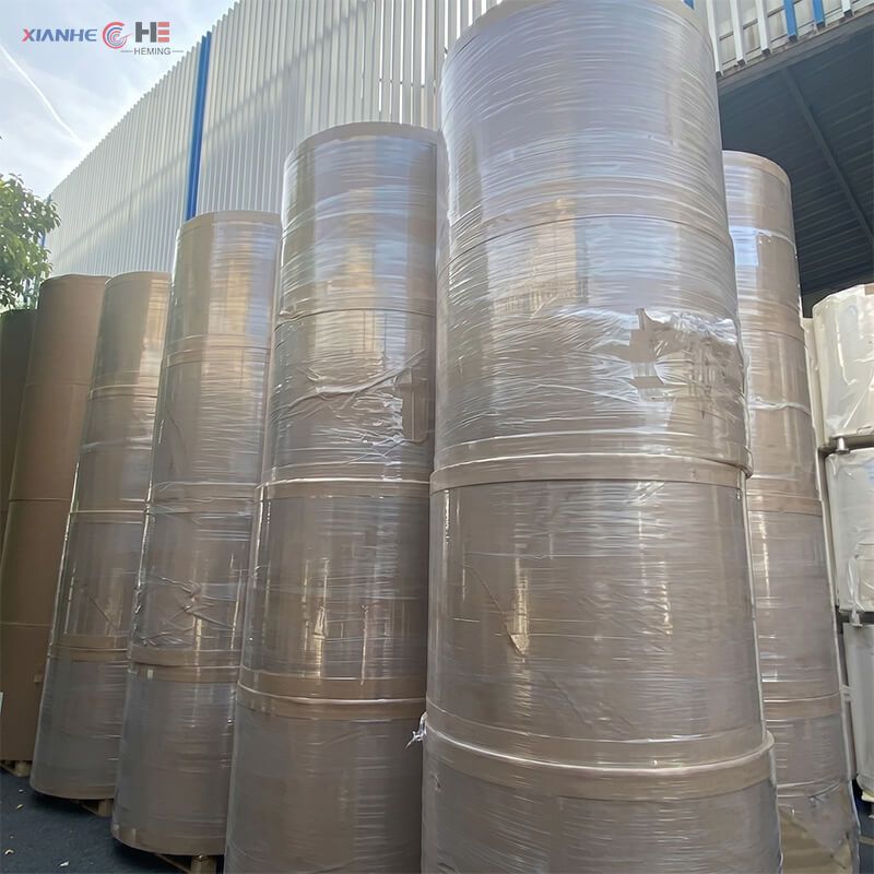 Wholesale greaseproof paper jumbo rolls stored in factory warehouse