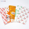 Direct multi-color flexo printed greaseproof paper sheets showing custom brand logos and patterns