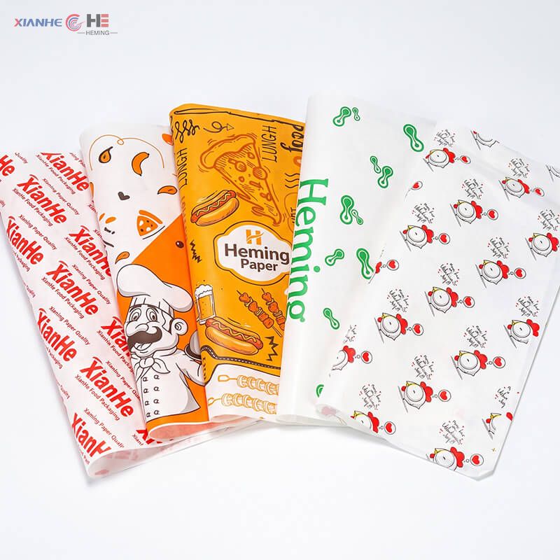 Direct multi-color flexo printed greaseproof paper sheets showing custom brand logos and patterns