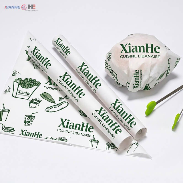 Custom printed greaseproof paper sheets used for wrapping hamburgers and fast food