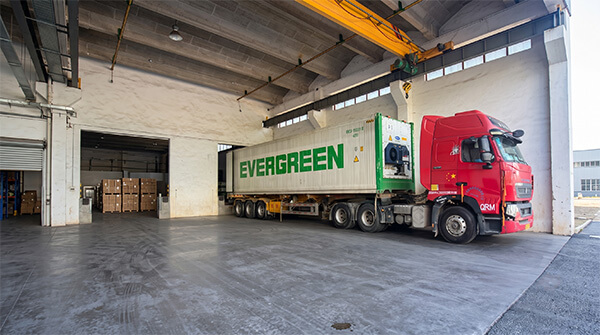 A shipping container truck loading electrolytic capacitor paper for global export logistics and support.