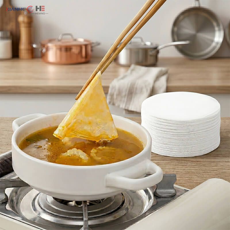 Using grease absorbing sheets for soup to remove floating fat during cooking