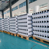 Pallets of wholesale silicone baking paper rolls packed on wooden pallets in factory warehouse