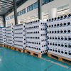 Palletized greaseproof paper slit rolls wrapped in PE stretch film for container export shipping