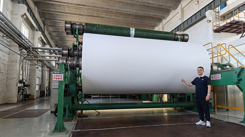 High-speed specialty paper making machine producing base paper jumbo rolls at Quzhou Xianhe headquarters